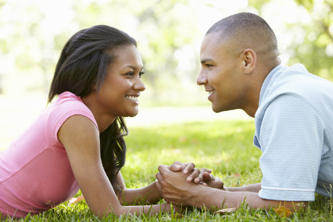 https://getherbackguide.com/wp-content/uploads/2017/10/African-American-couple-in-love-holding-hands-laying-down-outdoors.jpg