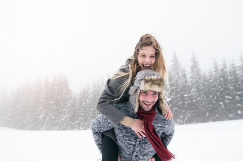 Couple having fun in the snow.
