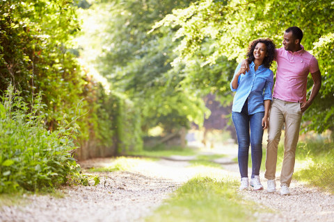 black couple walking having fun in nature