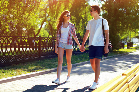 young lovers walking in the park