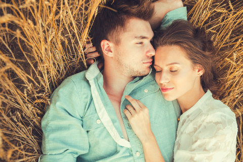couple relaxing in the hay