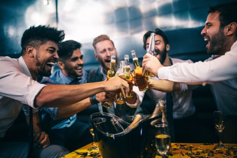 male friends having a fun night out drinking